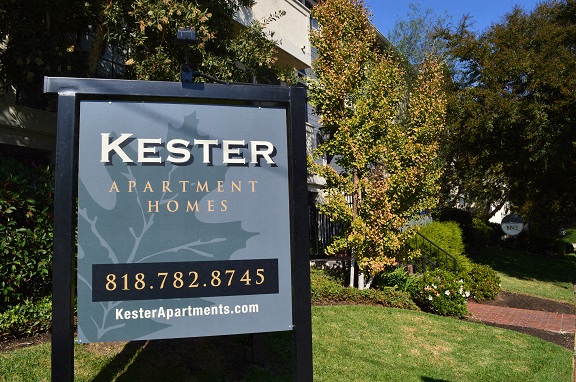 a sign is in front of a house