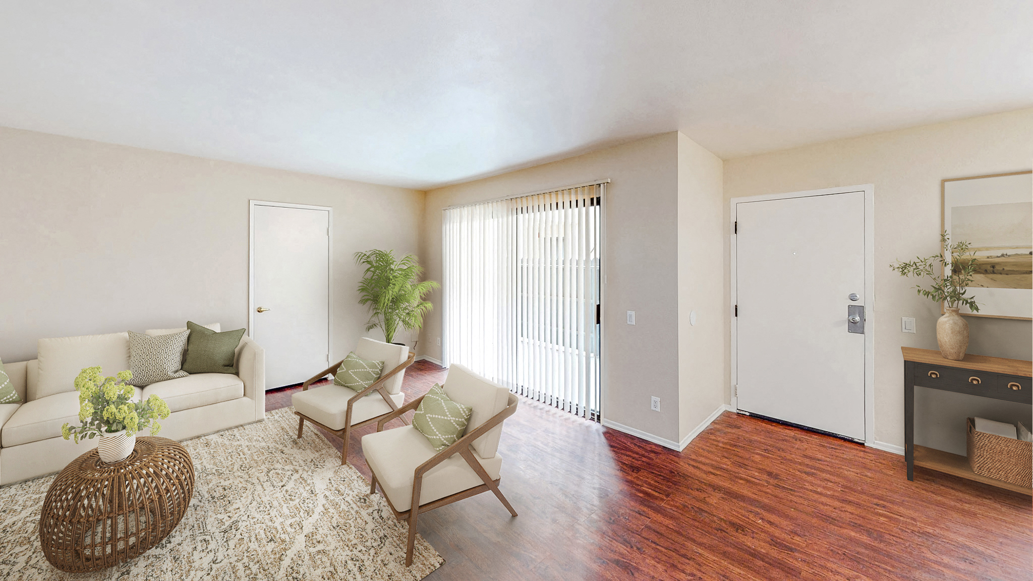 a living room with a couch and a chair and a fireplace