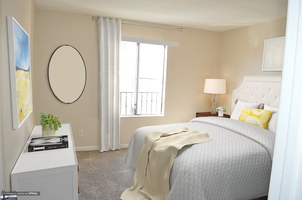 a bedroom with a bed and a white desk and a window