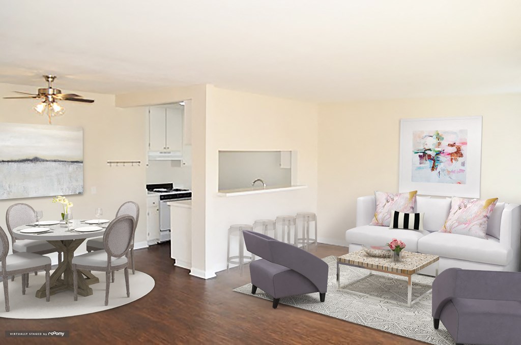 a living room with a couch and a dining table