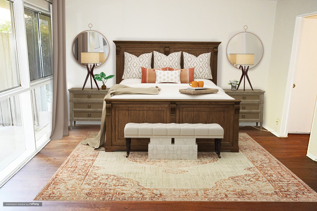 a bedroom with a bed and two mirrors and a stool