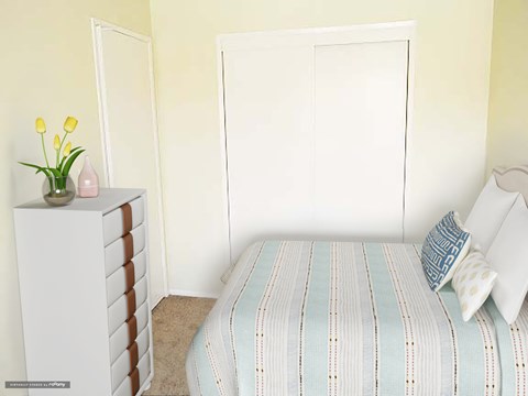 a small bedroom with a bed and a dresser