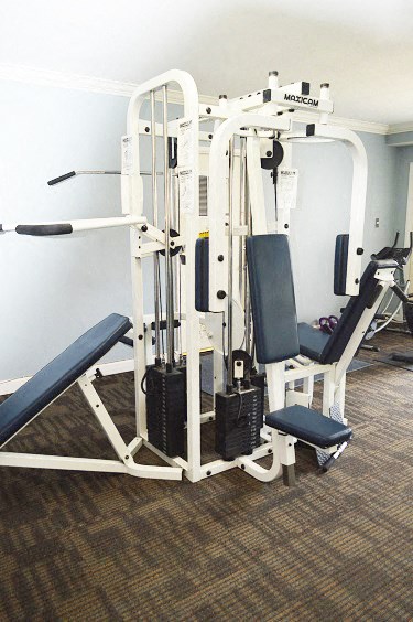 a gym with a exercise equipment in a room