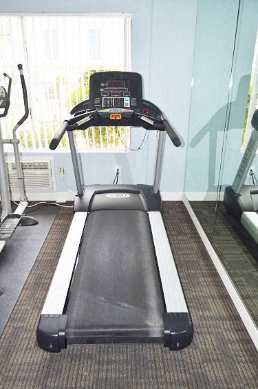 a treadmill in a room with a window