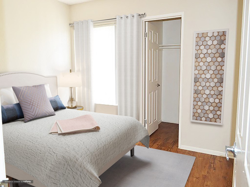 a bedroom with a bed and a closet with white doors