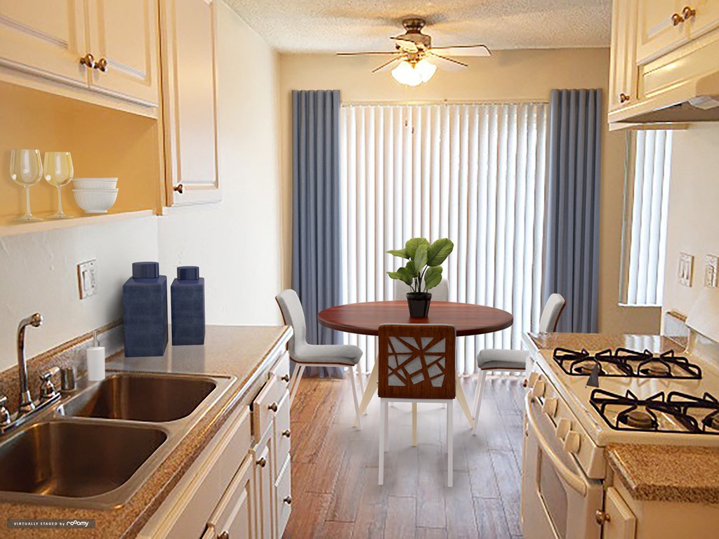 a kitchen and dining room with a table and a sink