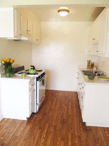a small kitchen with a stove and a sink