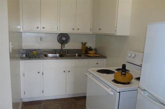 a small kitchen with a stove and a sink