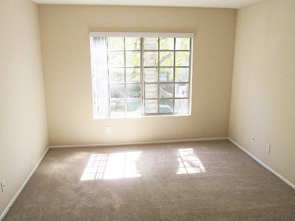 an empty room with a window in it
