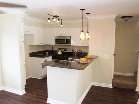 a kitchen with a counter top and a microwave