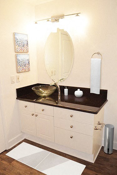 a bathroom with a sink and a mirror