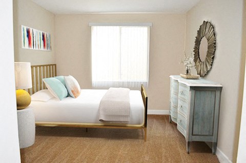 a bedroom with a bed and a dresser and a window