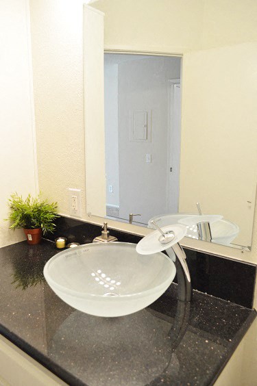 a bathroom with a sink and a mirror