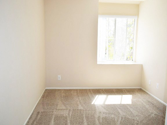 an empty room with a window in it