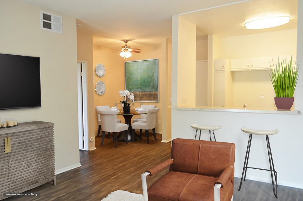 a living room with a couch and a table and a television