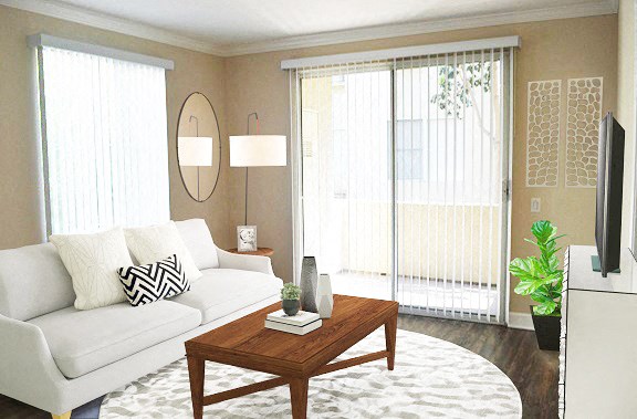 a living room with a white couch and a coffee table