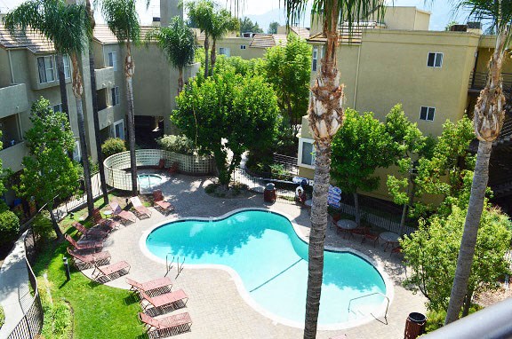 an aerial view of a swimming pool in an apartment complex
