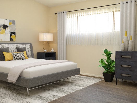 a bedroom with a bed and a dresser