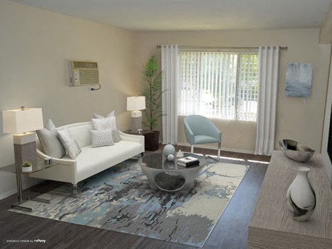 a living room with a couch and a chair and a rug