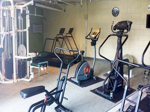 a gym with some exercise equipment in it
