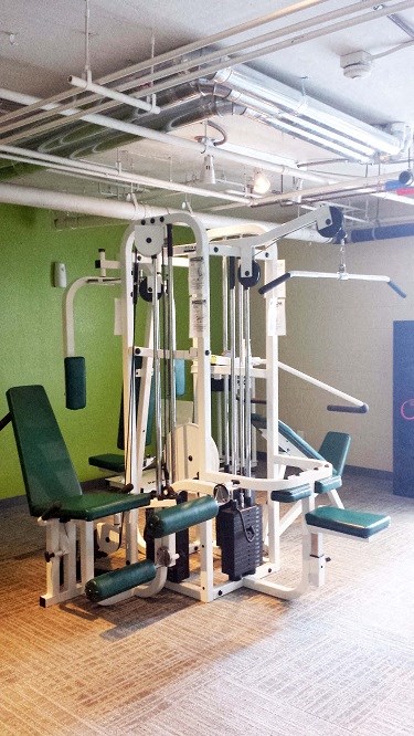 a gym with a lot of equipment in it