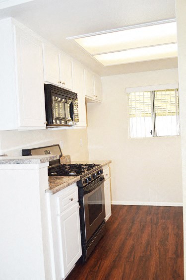 a kitchen with a stove and a microwave
