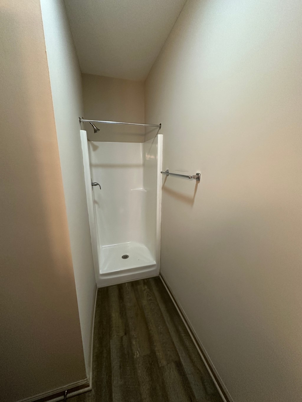 a small bathroom with a toilet and a shower