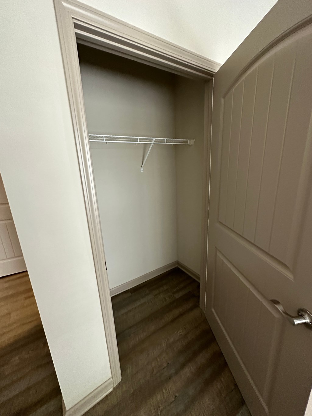 a room with a closet and a door to a closet