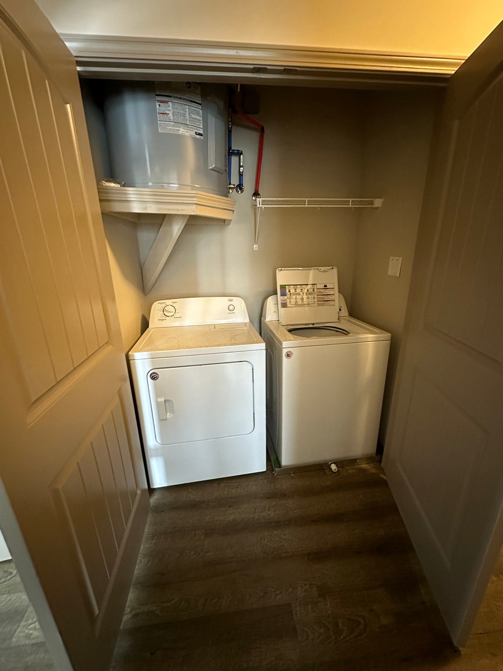a laundry room with two washes and a dryer in it