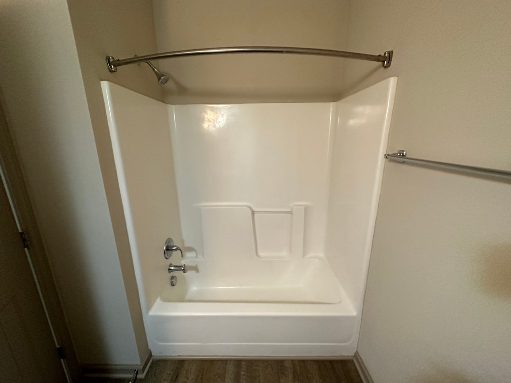 a small bathroom with a shower and a toilet