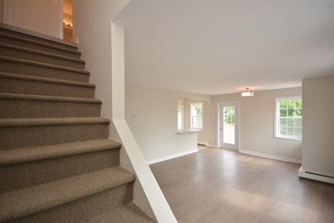 a view of a living room and a staircase