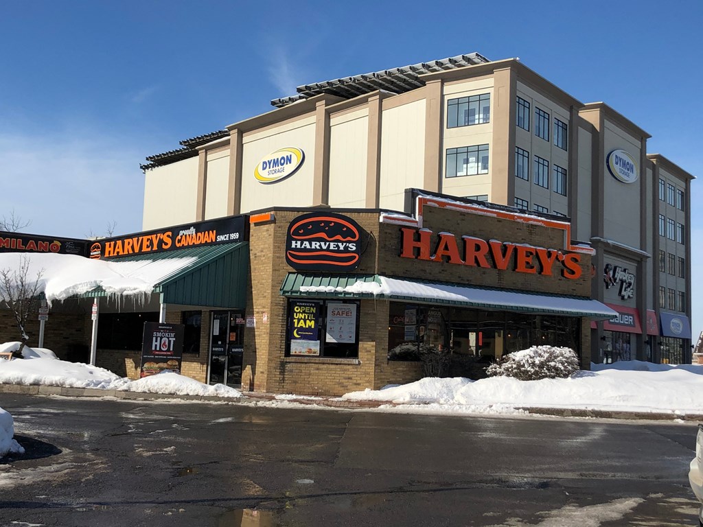 a harvester store on a city street in the snow