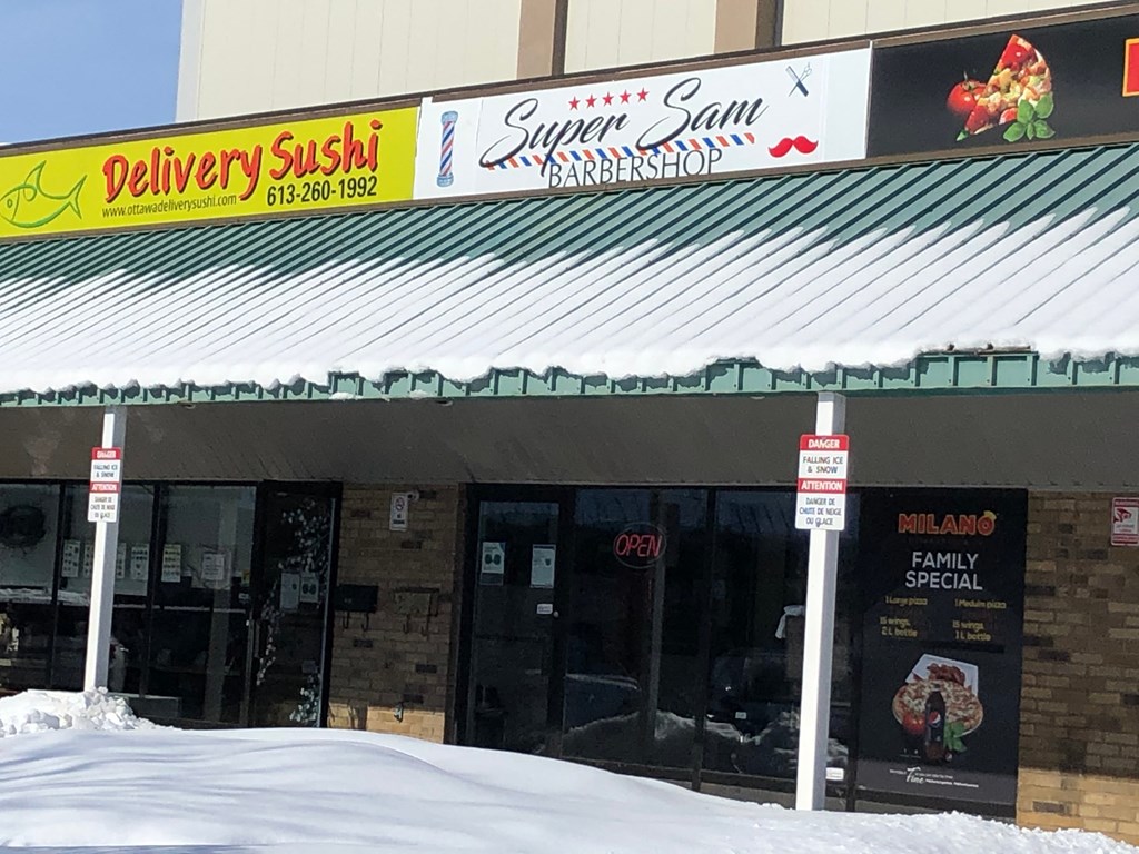 the front of a restaurant in the snow