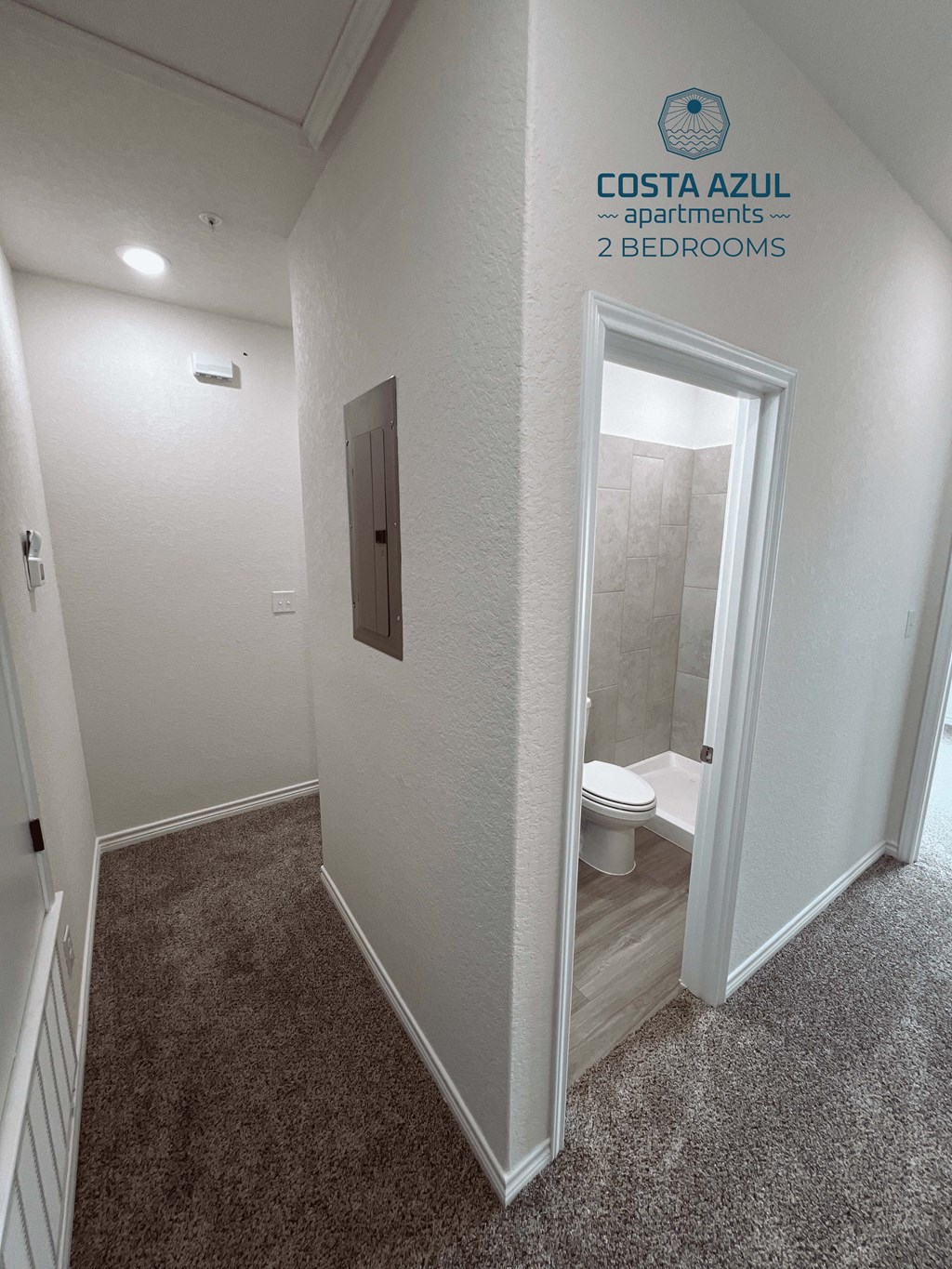 a small bathroom with a toilet and a walk in shower