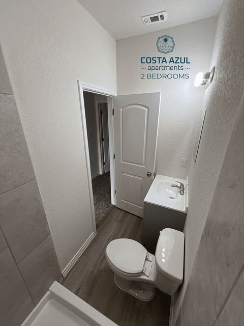 a small bathroom with a toilet and a sink