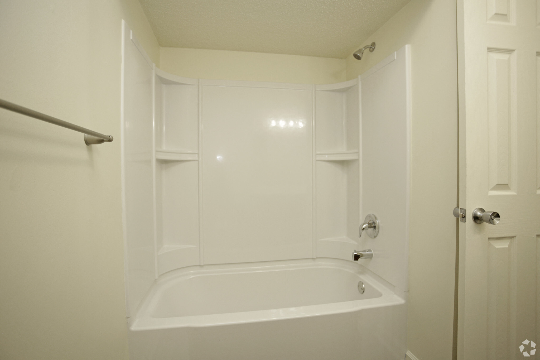 White tub/shower with built in shelves