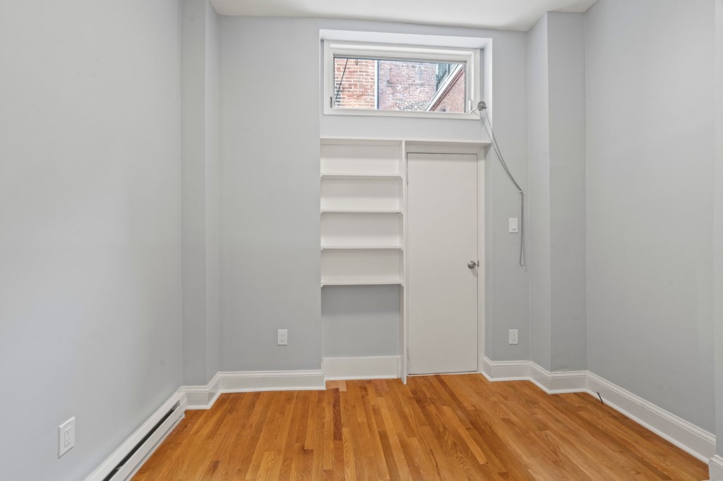 A room with a staircase and a window.