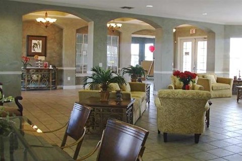 a large living room with furniture and a table