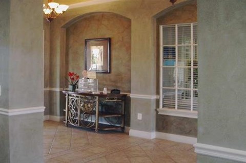 a dining room with a table and a window