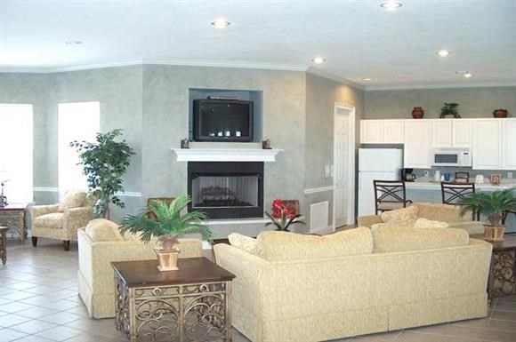 a living room with couches and a fireplace