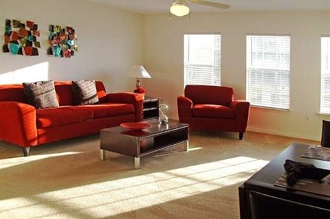 a living room with a couch and a chair