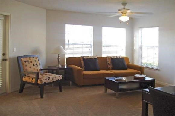 a living room with a couch and a chair