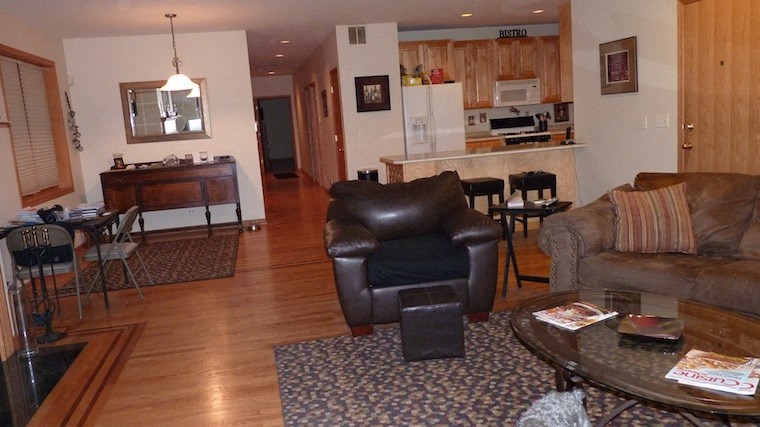 a living room with a couch a chair and a table