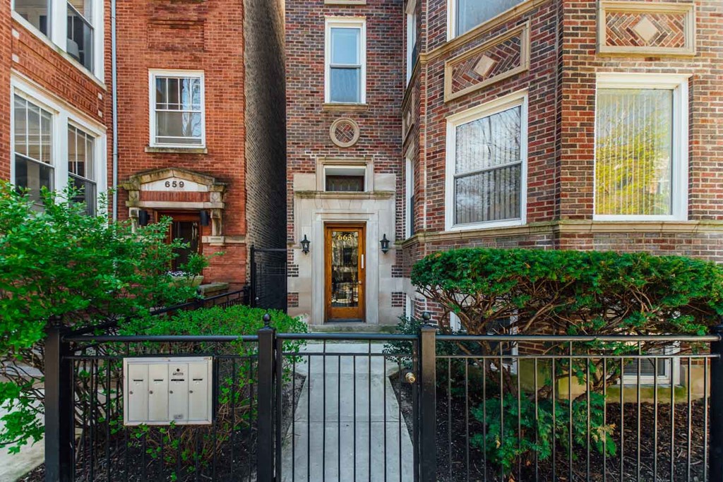 a view of the front of a building with a gate