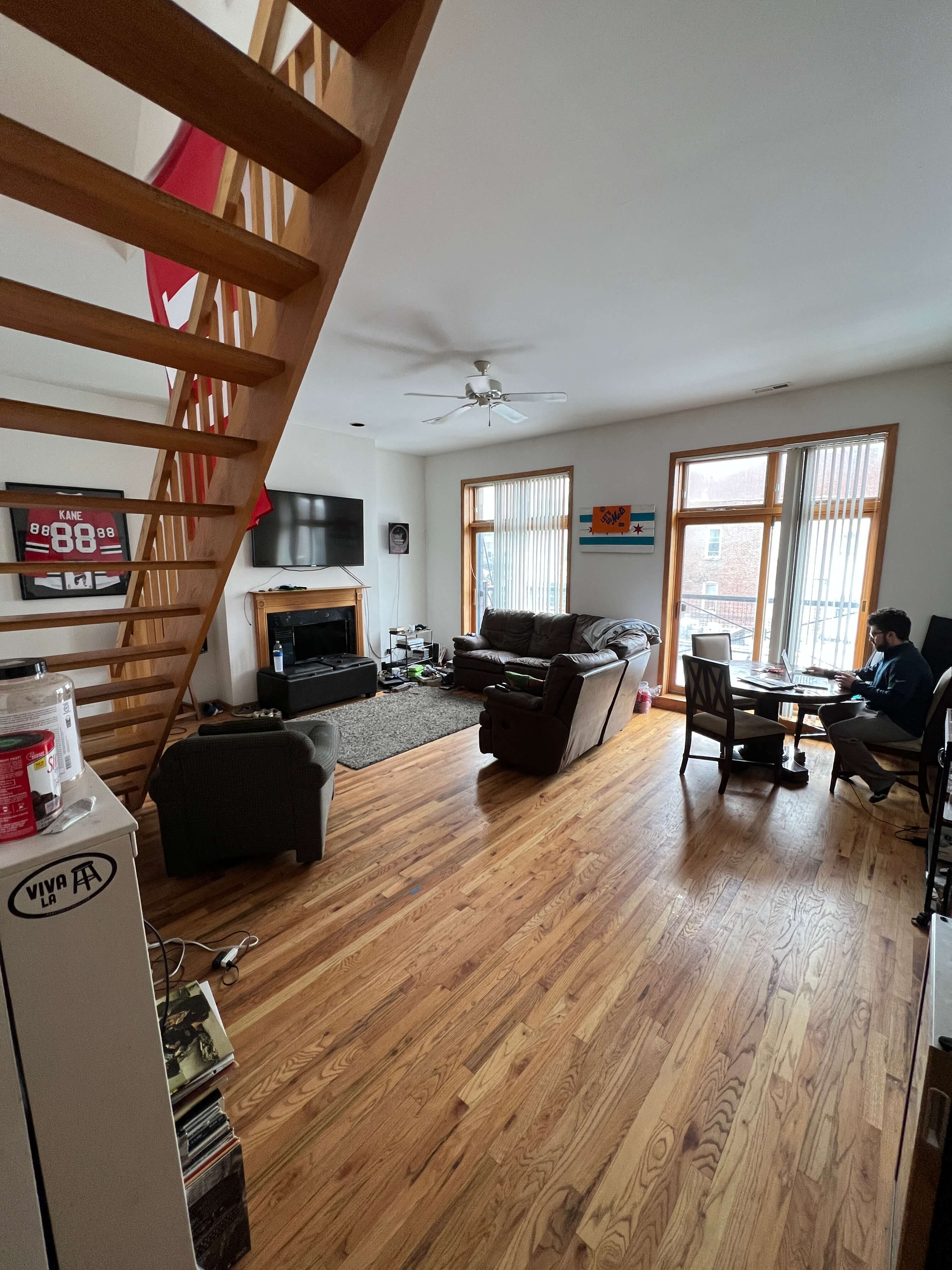 a view of the living room and dining room from the stairs