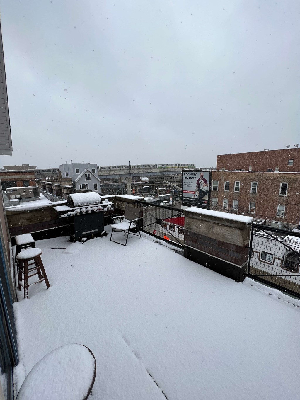 a roof top deck covered in snow