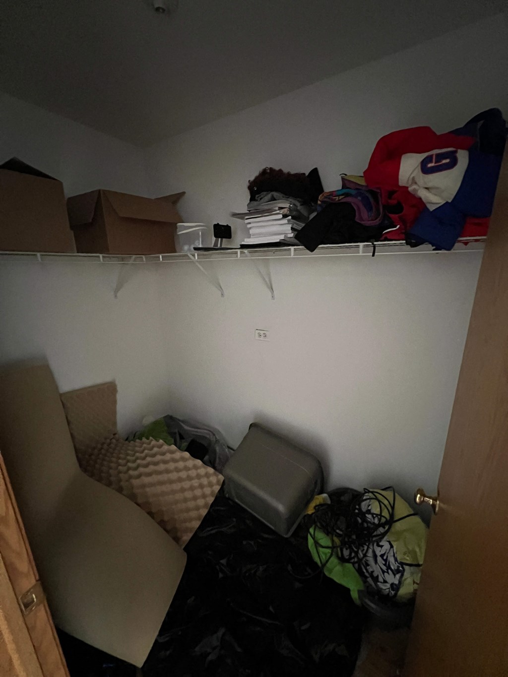 a living room filled with furniture and a closet