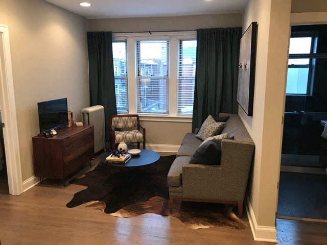 a living room with a couch and a table