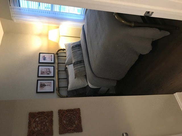 a room with a bed and a mirror in it