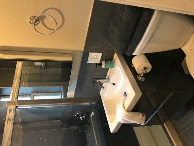 a bathroom with a sink and a toilet in it